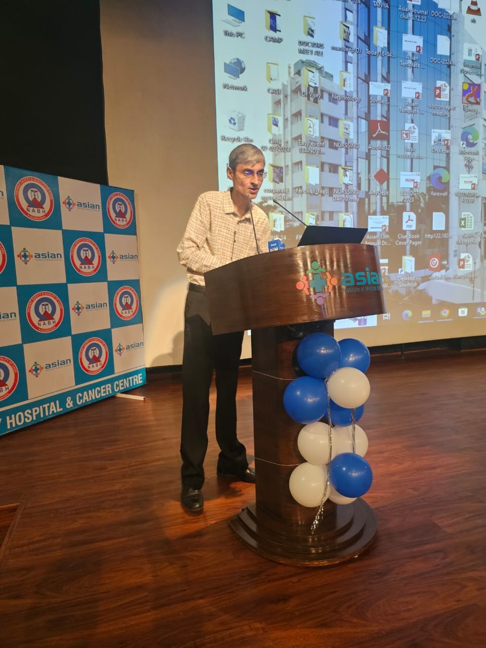 Understanding Vasculitis event — speaker at podium